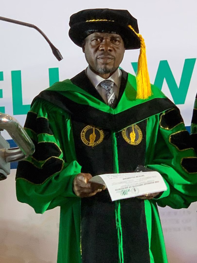 FUTIA FELICITATES DIRECTOR OF PHYSICAL PLANNING ON HIS INDUCTION AS A FELLOW OF NIA